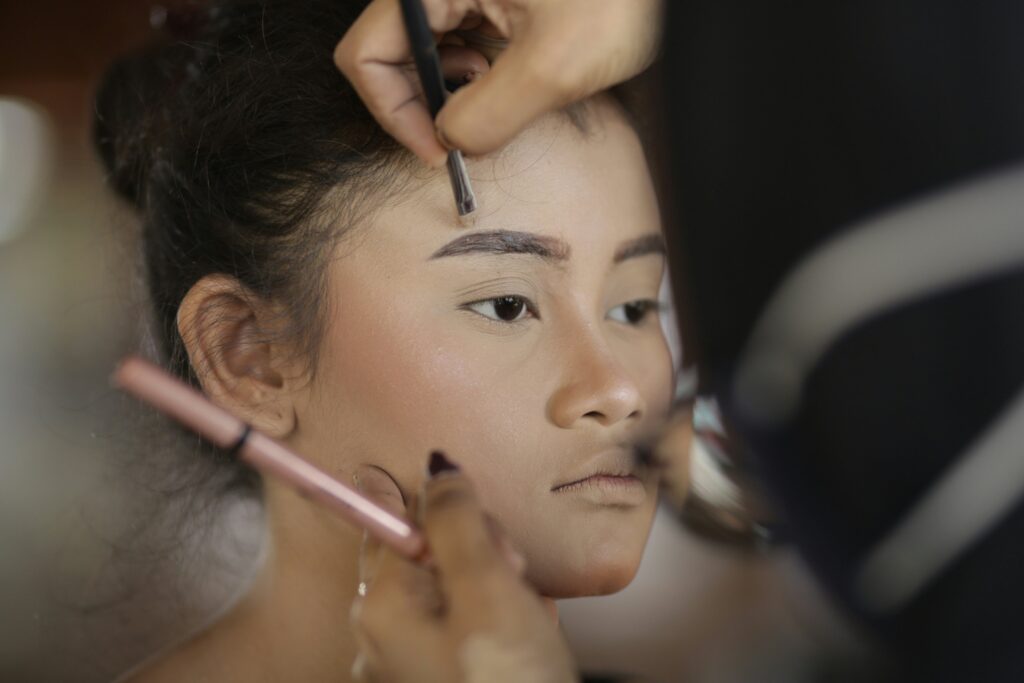 women in makeup acne hidden with foundation