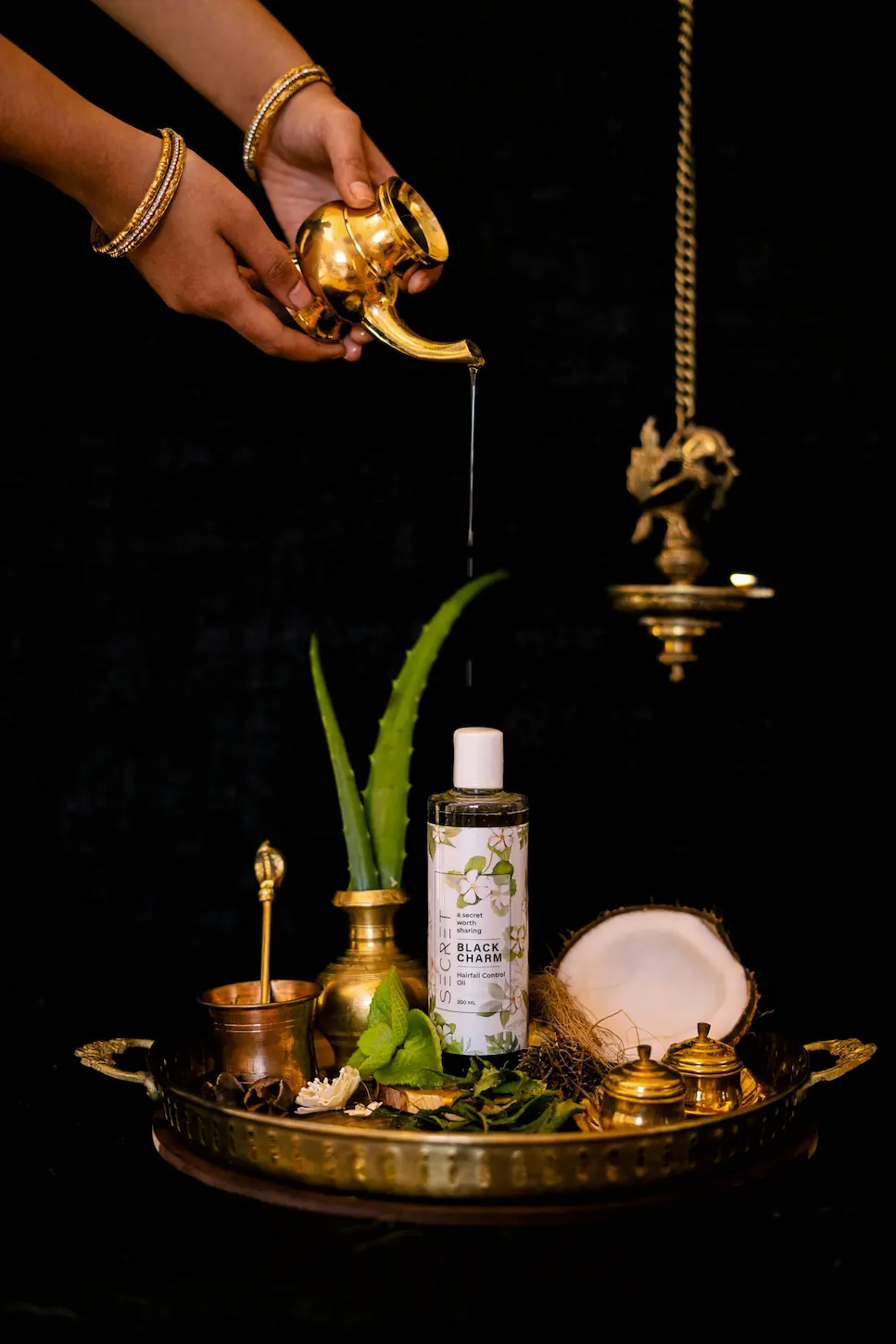 person applying natural body lotion on hand