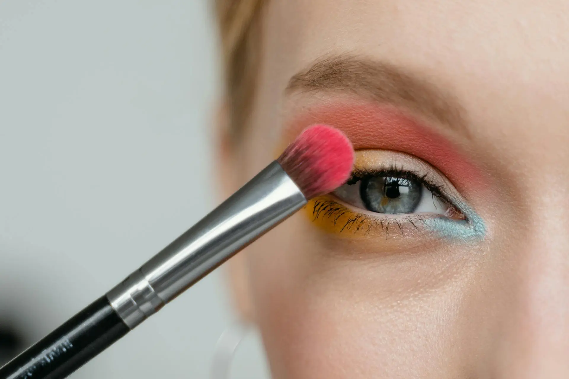 applying bright eyeshadow for vibrant look
